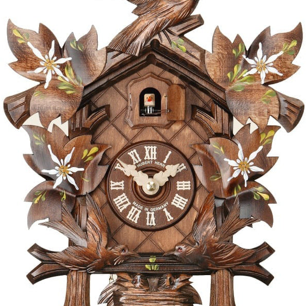 Carved 8day cuckoo clock with moving birds and handpainted edelweiss